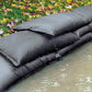 Water-absorbing and expanding flood control sandbags